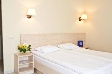 Фото номера Улучшенный двухместный номер с 1 кроватью Отель Kolonna Hotel Rēzekne г. Резекне 6